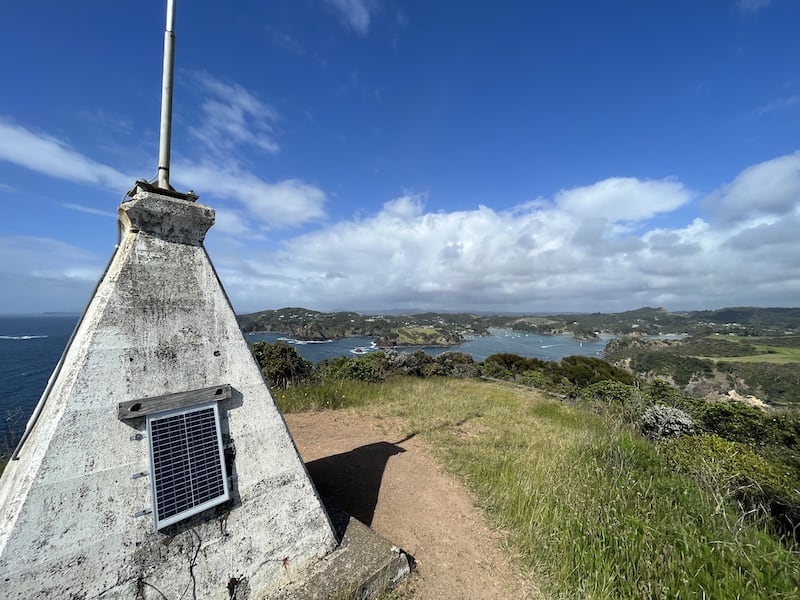 The Lighthouse in the foreground surrounded by the view back up towards the town of Tutukaka
