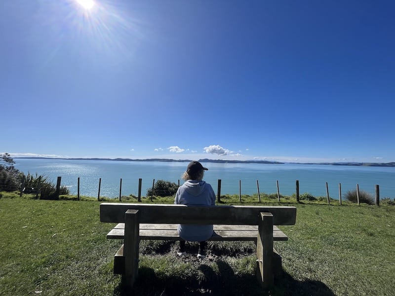 Person sitting on a bench enjoying the views at Duder Regional Park