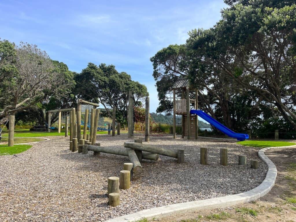The playground with a slide, monkey bars and climbing poles