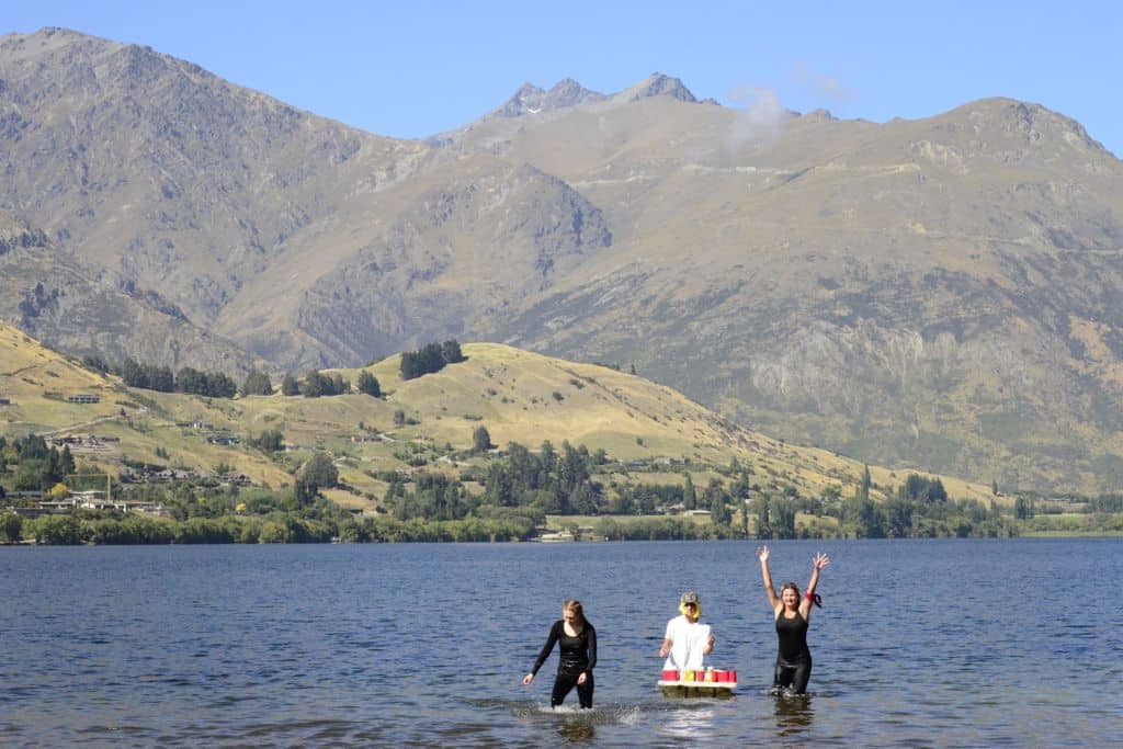 People having fun in the water at Lake Hayes near Queenstown