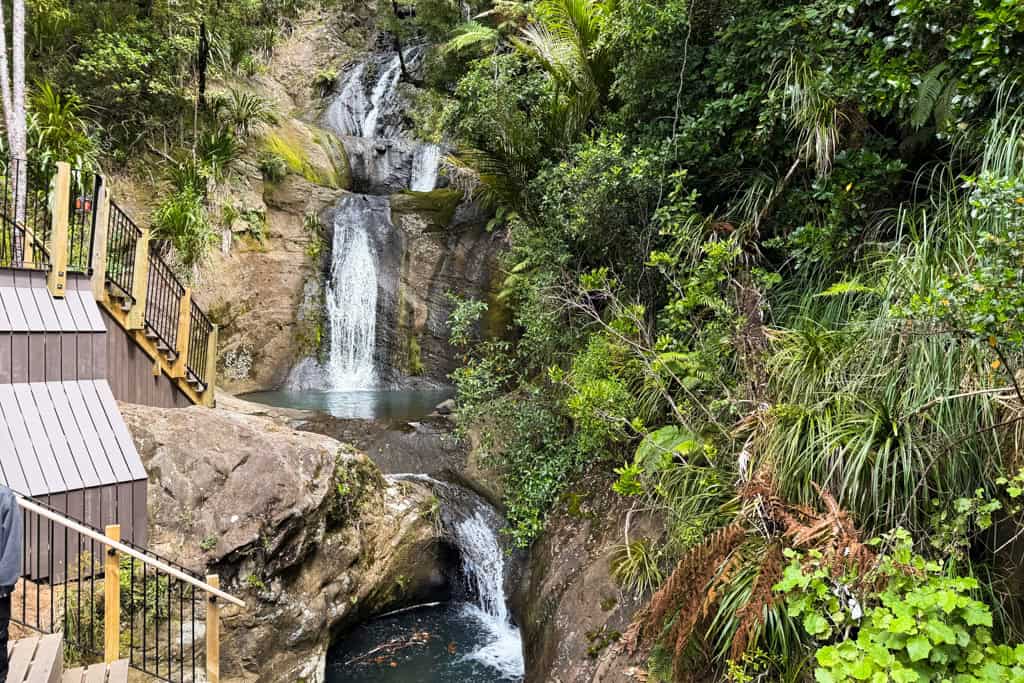 Stairs leading into the blue water at Fairy Falls