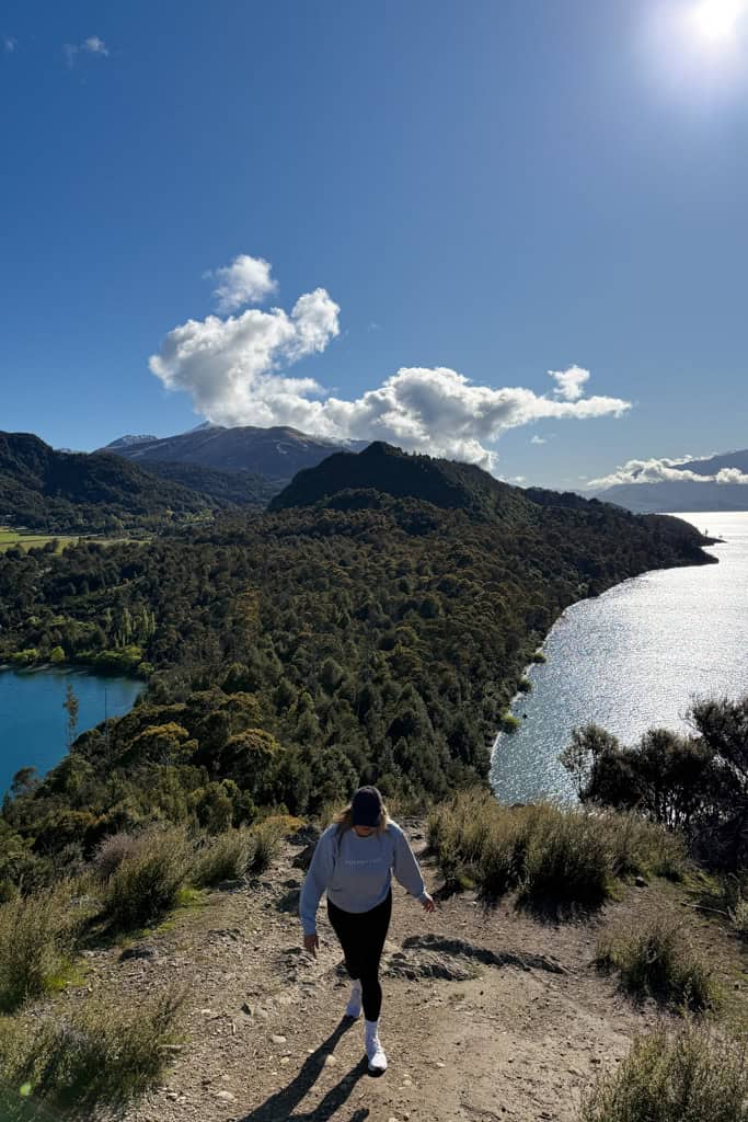 Girl walking up the hill to the lookout.