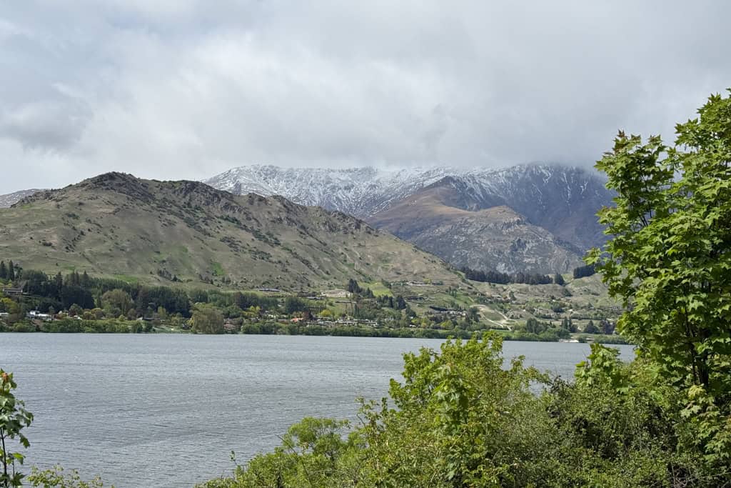 The view of the lake on a cloudy day at Lake Hayes.