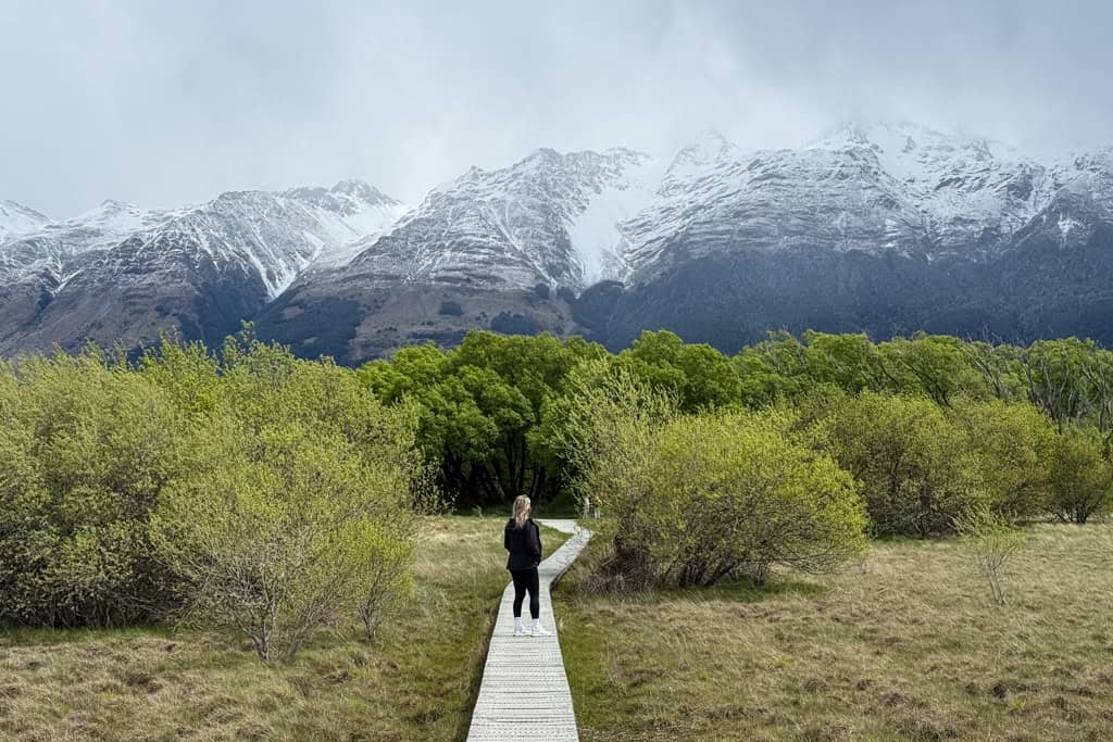 Girl walking along to board walk on the Glenorchy Lagoon Walk.