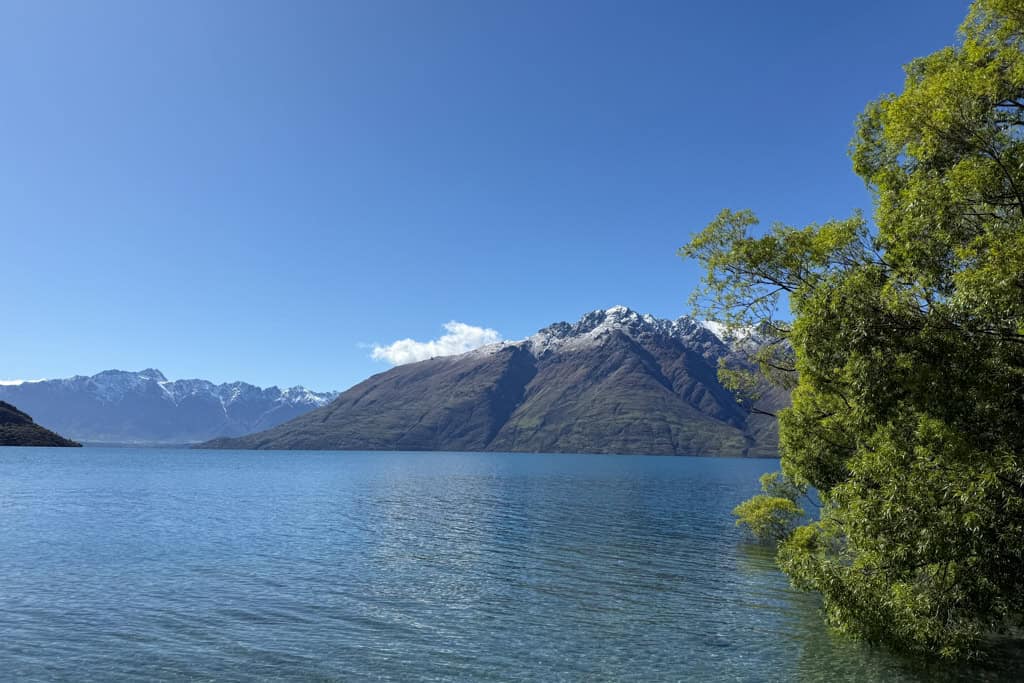 The mountain across the lake from Sunshine Bay covered in snow.