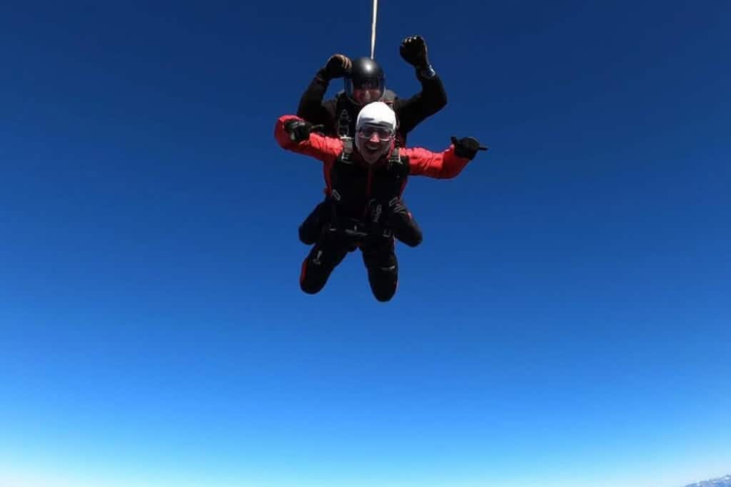 Man with a huge smile on his face doing a skydive over Wanaka.