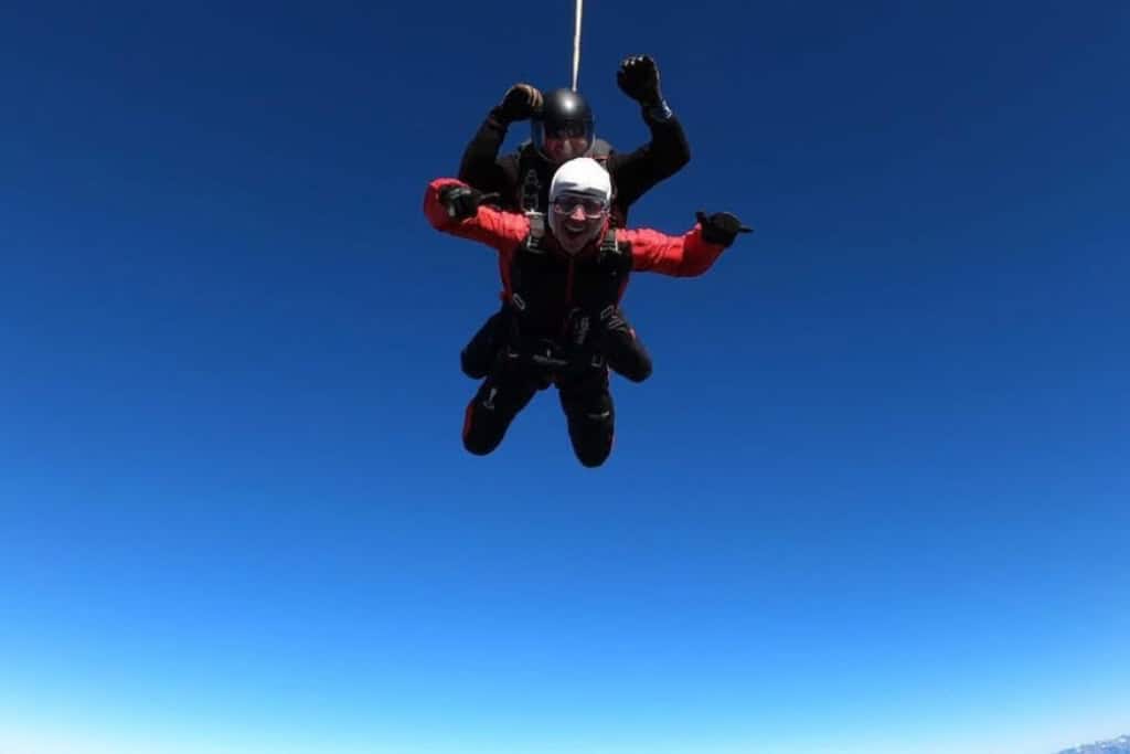 A person enjoying a tandem skydive in Auckland.