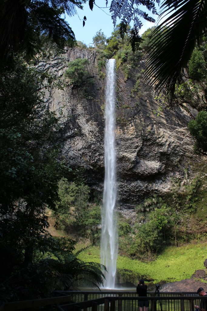 View up from the bottom of Bridal Veil falls with water falling into the pool below.