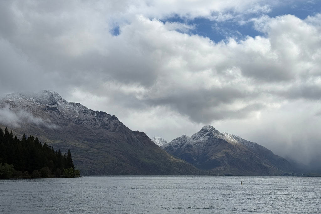 Snowy mountains standing tall over Lake Wakatipu.