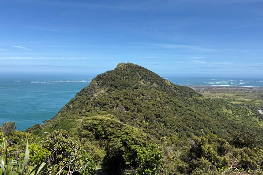 The hills covered in native bush along the track.