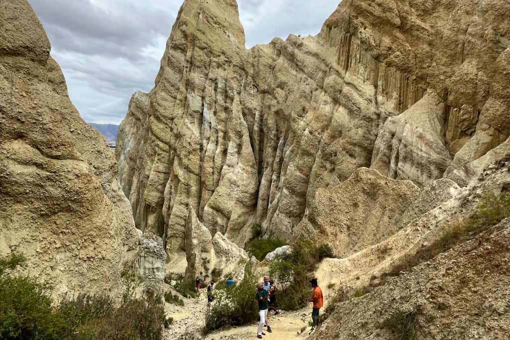 Looking down between the cliffs as people walk through.