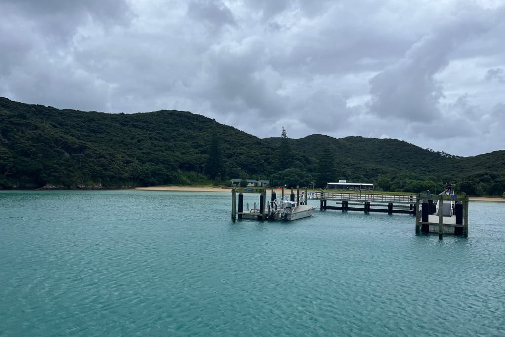 The wharf surrounded by turquoise water on Urupukapuka Island.