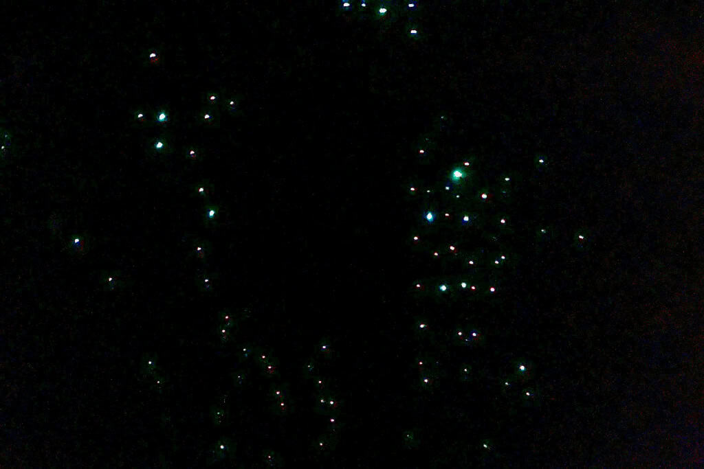 The glowing lights of the glow worms in the dark.
