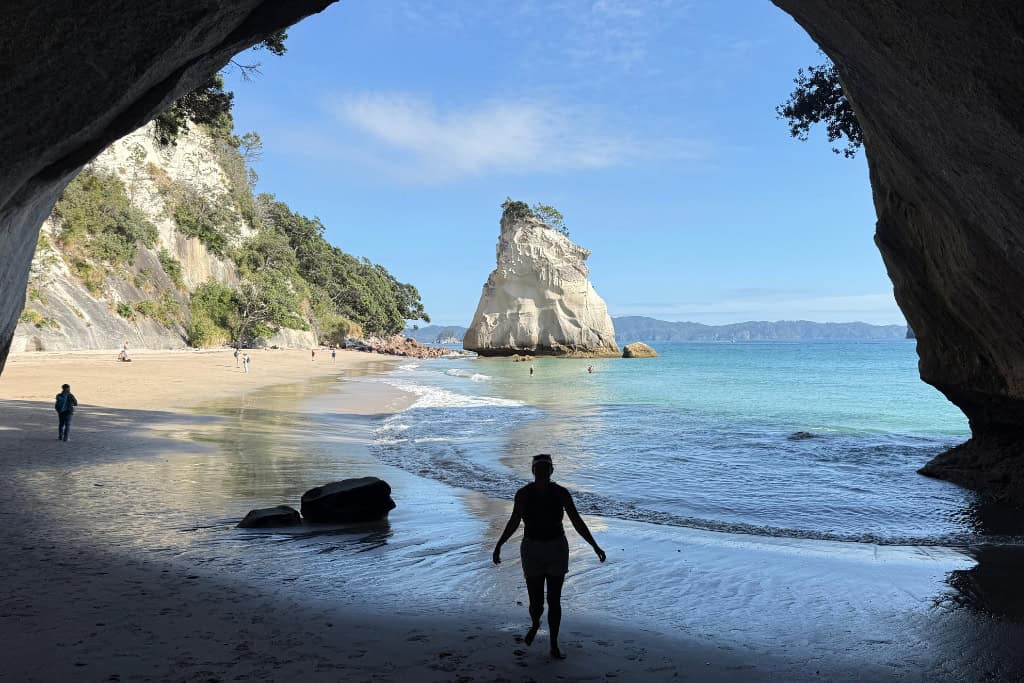 Woman standing in the archway at Cathedral Cove.