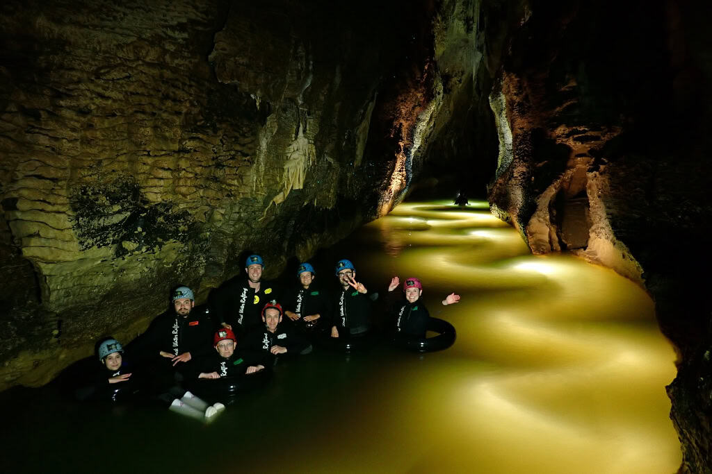 A group of people on a day trip from Auckland going black water rafting.