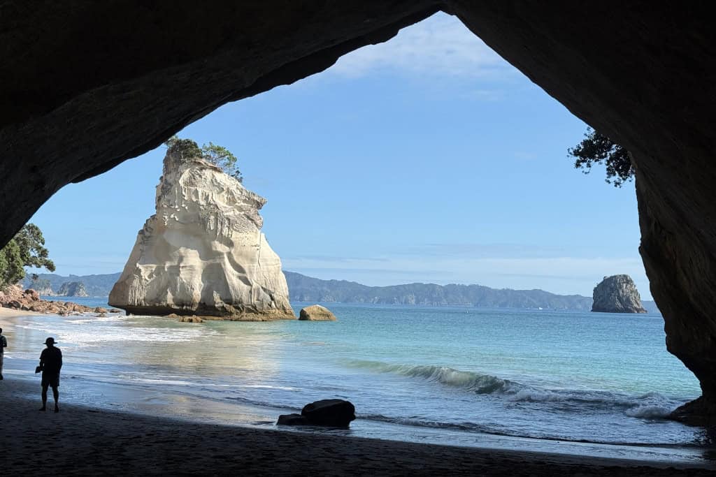 The view through the arch at Cathedral Cove, a great day trip from Auckland.