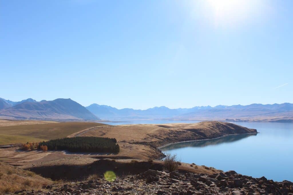 Beautiful Lake Tekapo surrounded by mountains in New Zealand's wilderness.