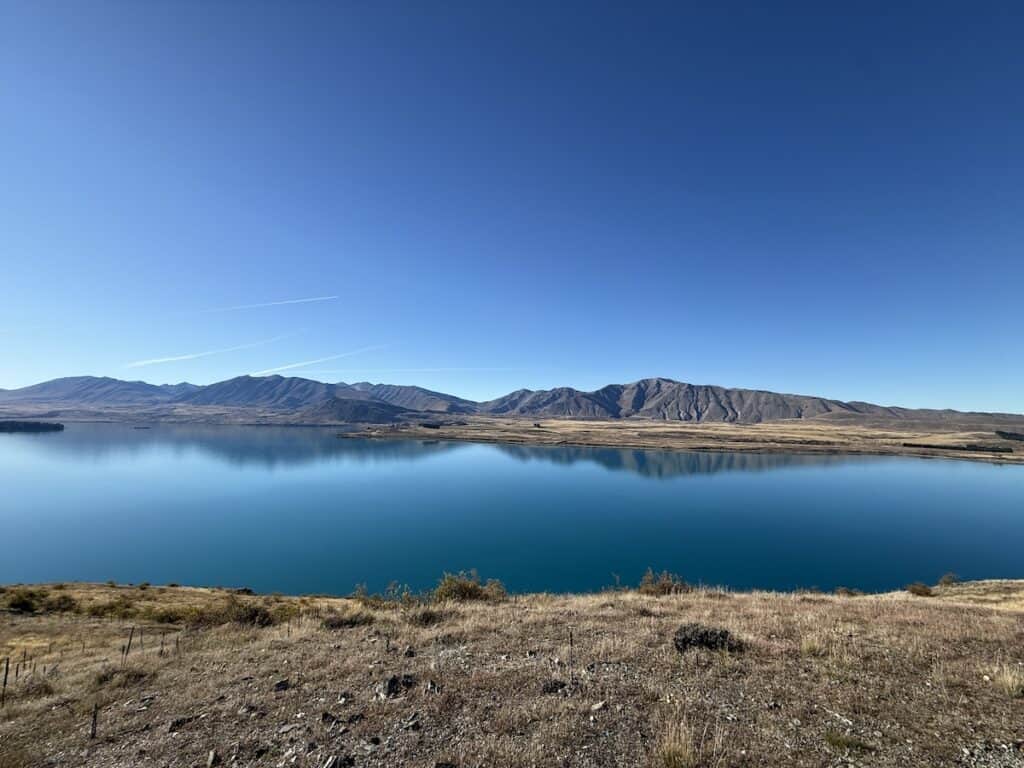 The sparkling blue water lake from the Mt John walk.