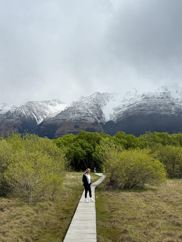 Person walking along the boardwalk on the Glenorchy Lagoon track.