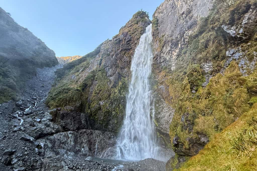The base of Devils Punchbowl waterfall in the South Island as water crashes down.