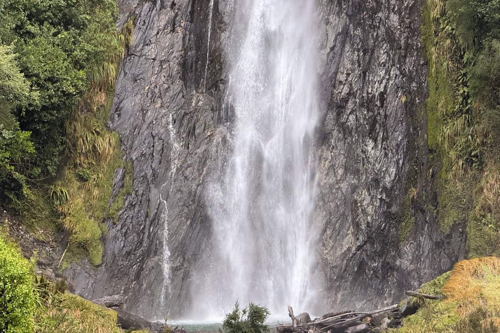 Water falling into the pool at the bottom of Thunder Creek falls along the Haast Pass in the South Island.